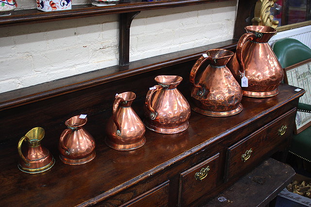 Appraisal: A MATCHED SET OF FIVE GRADUATED VICTORIAN COPPER MEASURES ranging