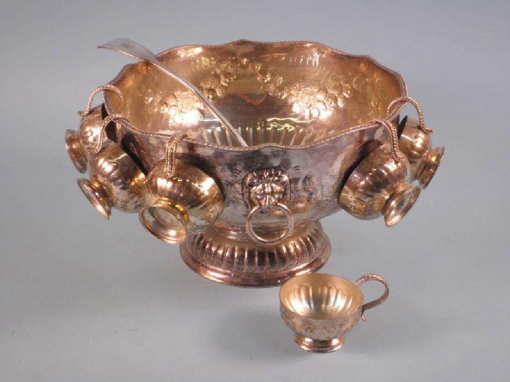 Appraisal: A silver plated punch bowl embossed with flowers and lion