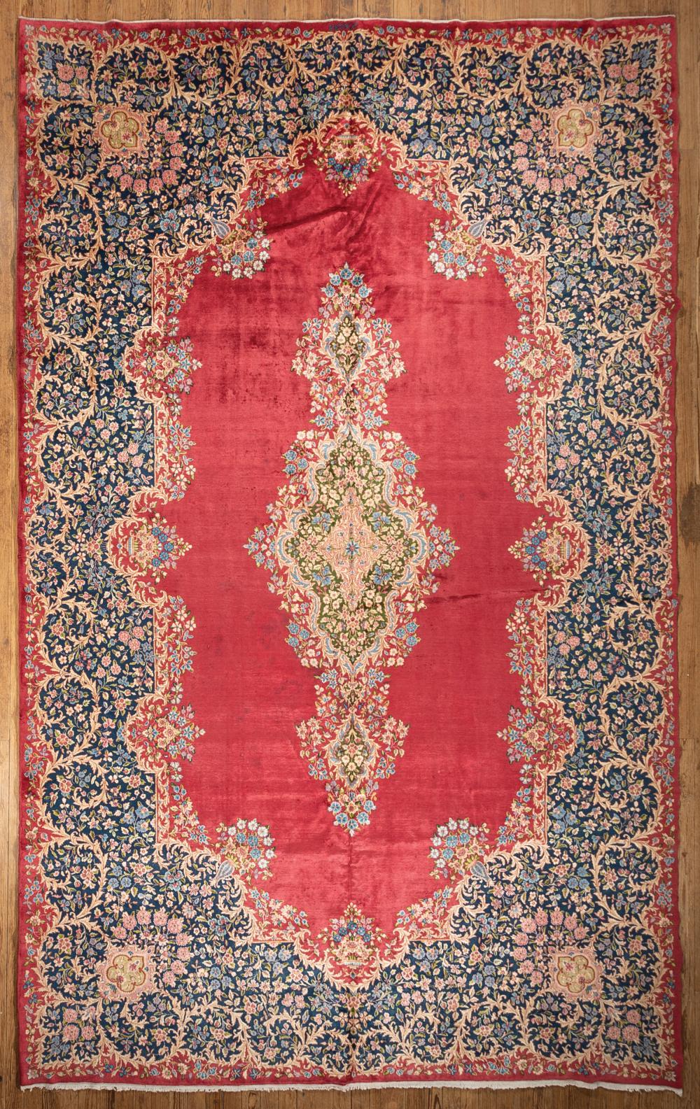 Appraisal: Persian Royal Kerman Carpet red ground central medallion blue floral