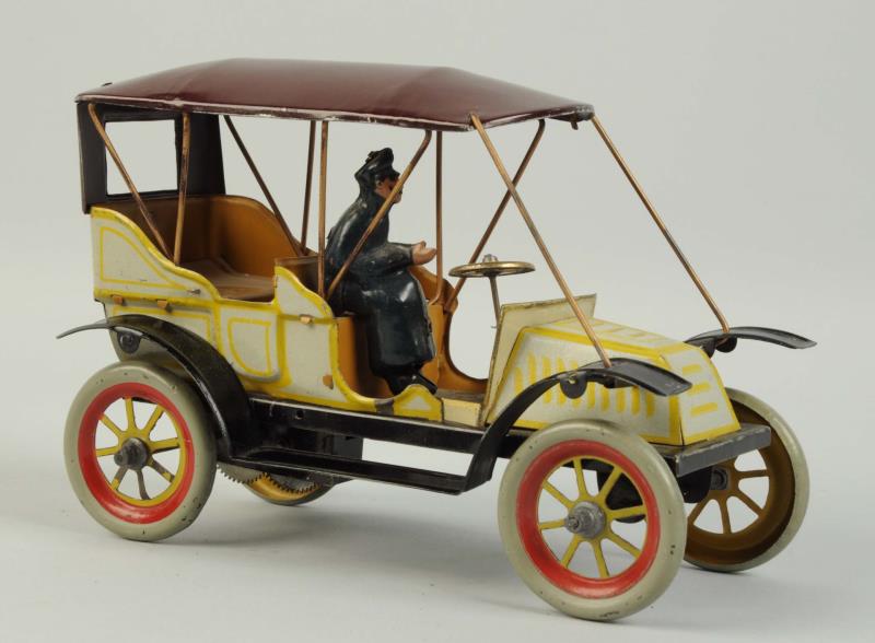 Appraisal: German Tin Litho Wind-Up Fischer Toy Automobile Original tin lithographed