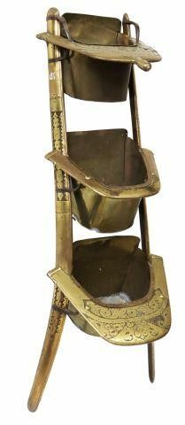 Appraisal: Brass-clad wooden Dromedary Regiment camel saddle now fashioned as three-tier