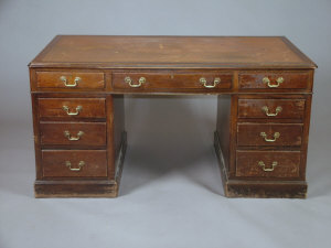 Appraisal: A mahogany pedestal desk circa the tooled leather top above