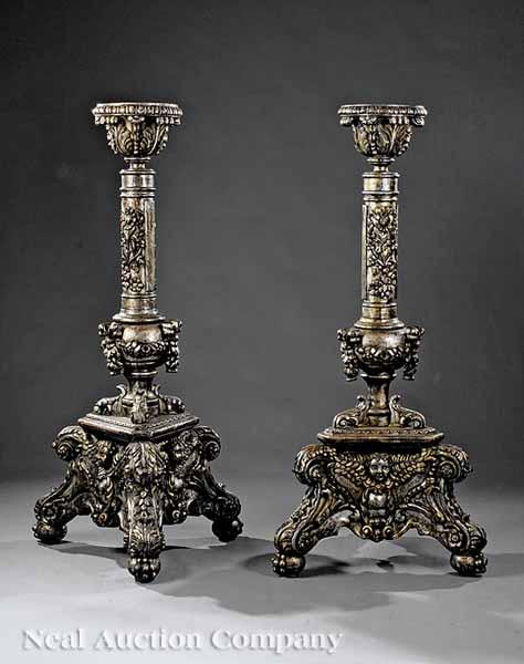 Appraisal: A Pair of Italian Rococo-Style Carved Argent Torch res the