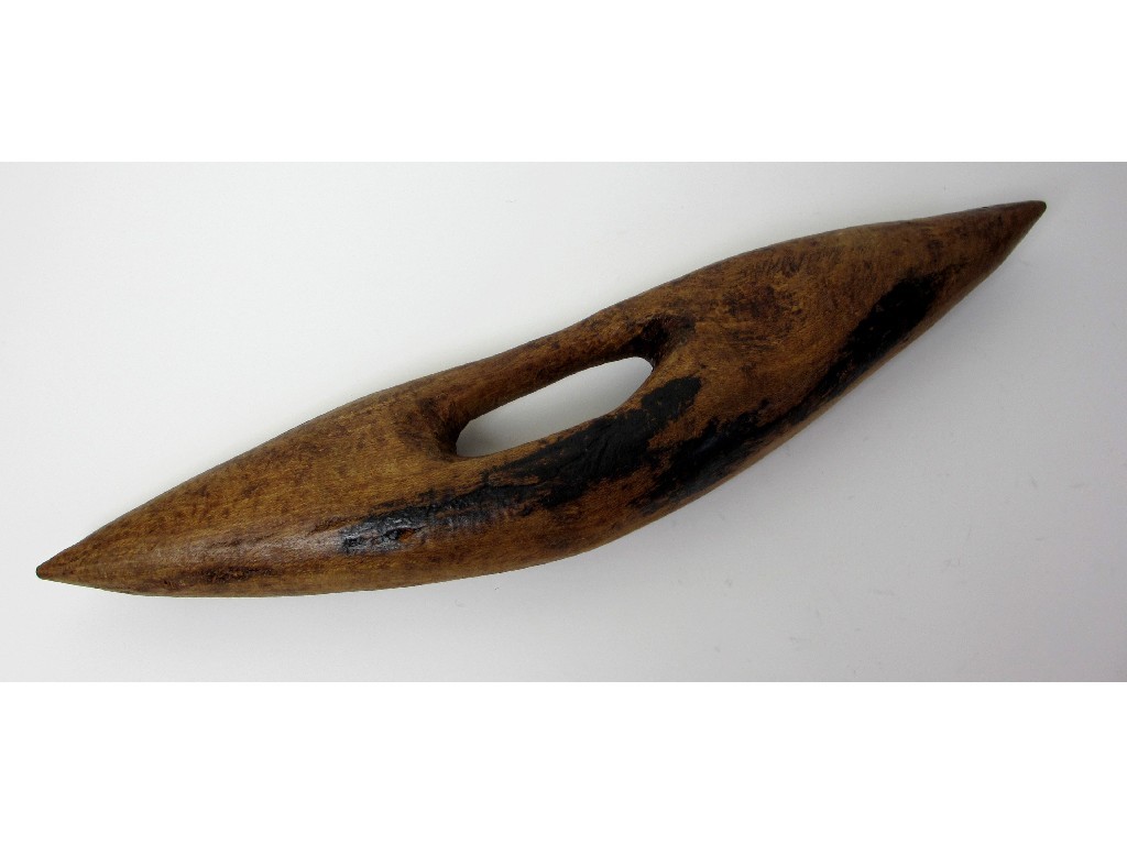 Appraisal: An aboriginal hardwood hand shield with oval cut hand grip