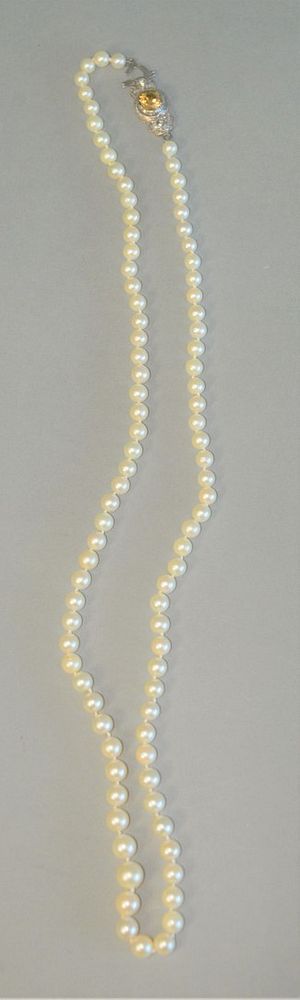 Appraisal: Single strand of pearls with large K white and yellow