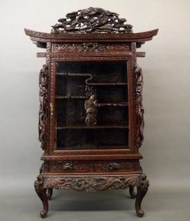 Appraisal: Japanese dragon cabinet An early th century Japanese hardwood Dragon