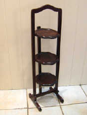 Appraisal: A mahogany thrtee tier folding cake stand Ht cm