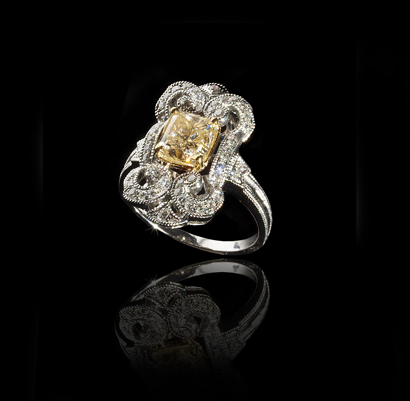 Appraisal: CT YELLOW DIAMOND RING K white gold ring centers a