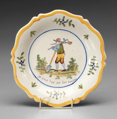 Appraisal: French faience bowl central scene with man carrying a sword