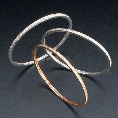 Appraisal: Three diamond bangle bracelets in k wg or rose gold