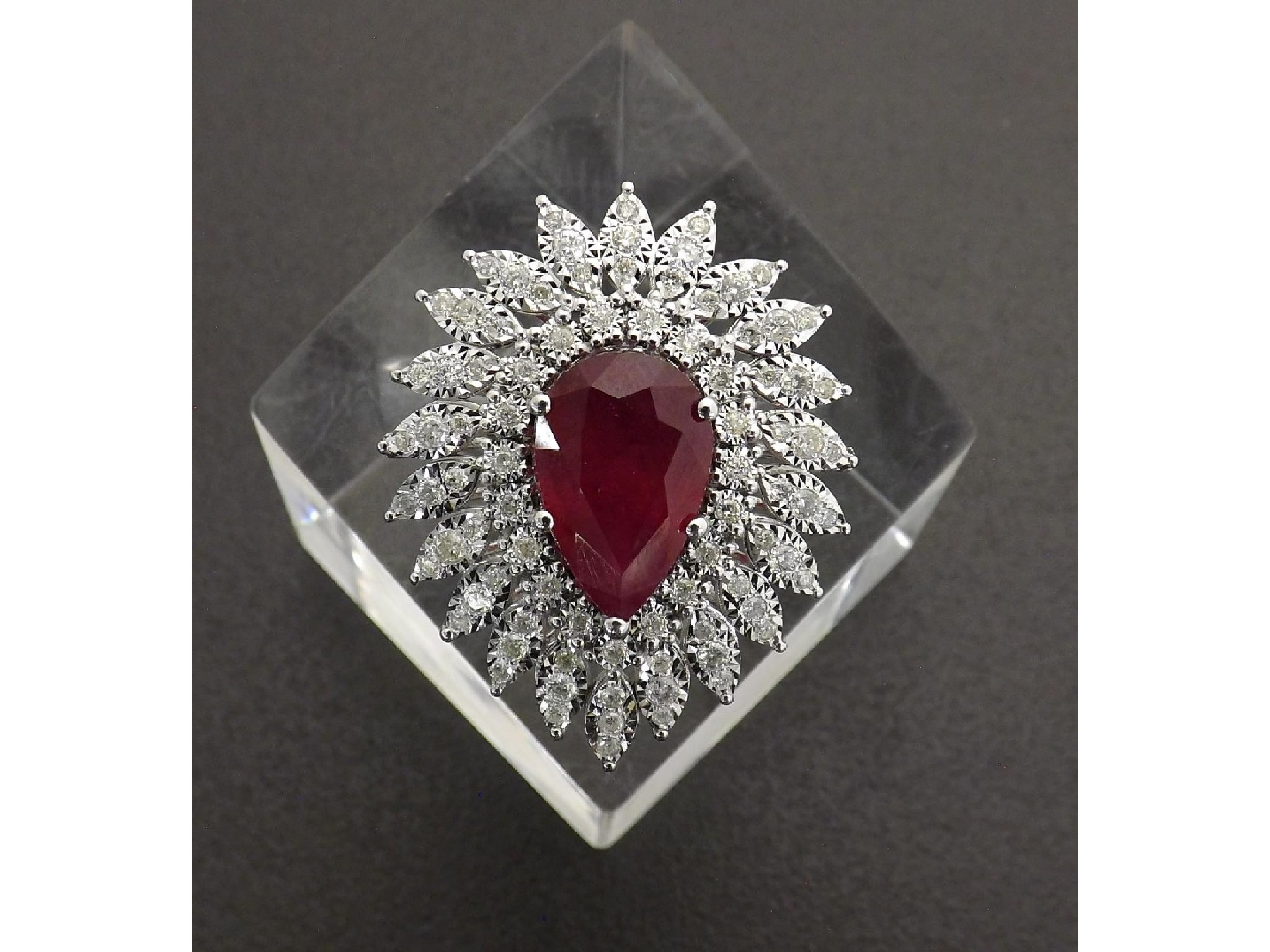 Appraisal: Large k white gold ruby and diamond pear shaped cluster