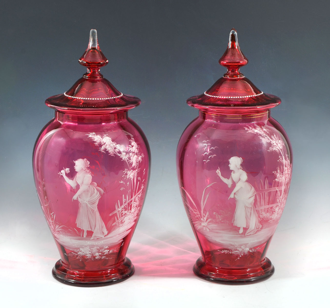 Appraisal: LARGE MARY GREGORY COVERED JARS optic panel cranberry glass lidded