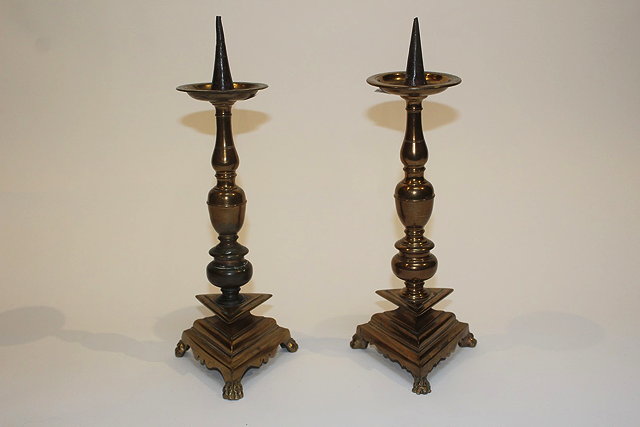 Appraisal: A PAIR OF ANTIQUE ITALIANATE BRONZE PRICKET CANDLESTICKS with ring