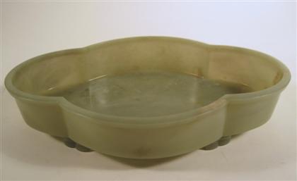 Appraisal: Chinese celadon jade footed quatrefoil bowl The large oblong bowl