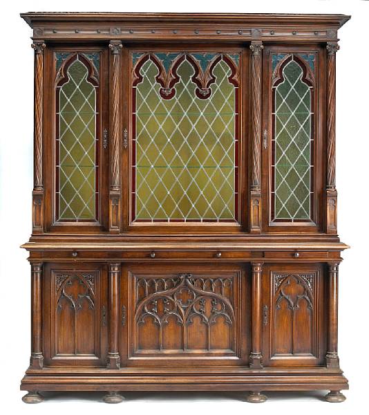 Appraisal: A large French Gothic style walnut biblioth que late th