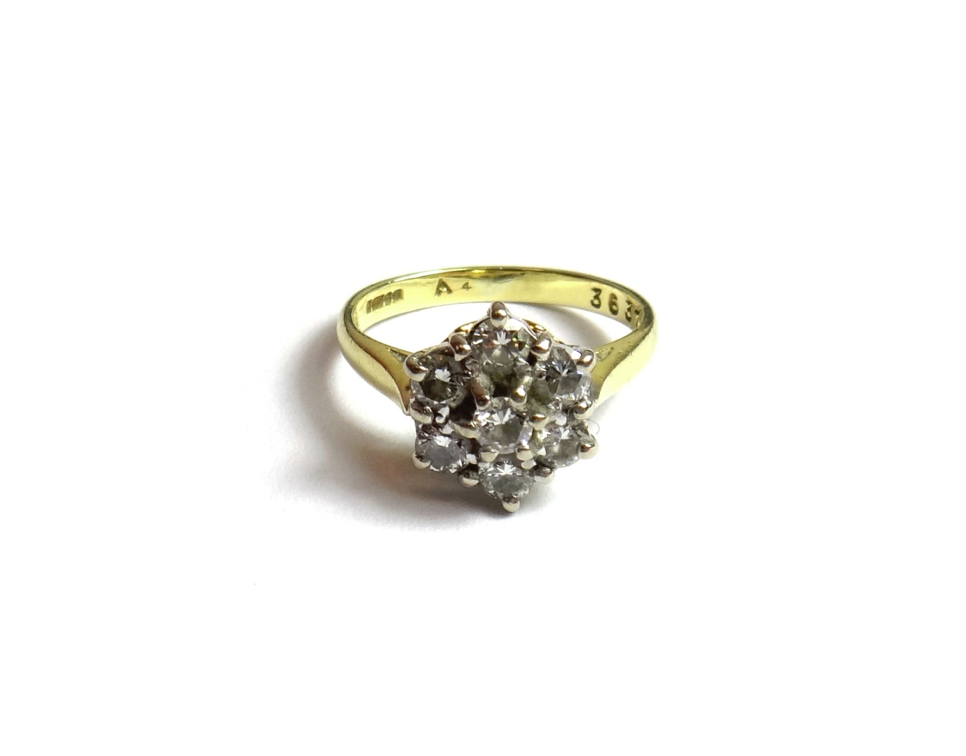 Appraisal: An ct gold and diamond set seven stone cluster ring