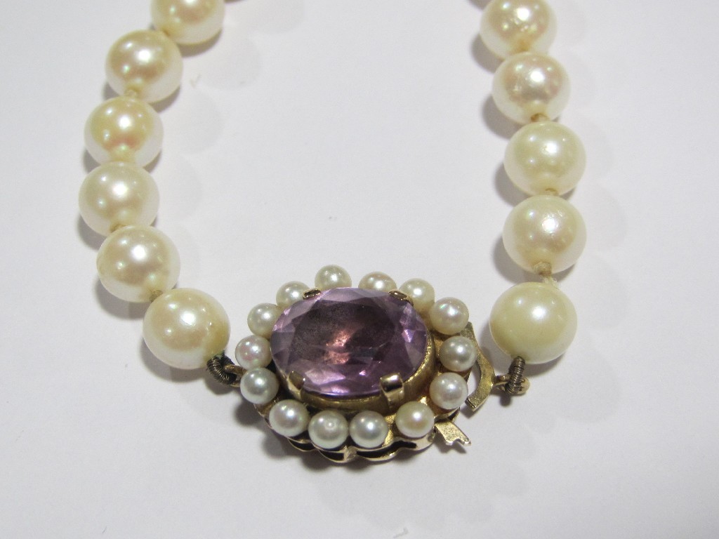 Appraisal: String of cultured pearl with gold amethyst and pearl cluster