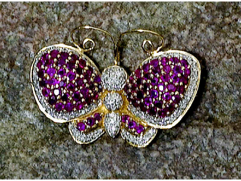 Appraisal: BUTTERFLY BROOCH k yellow gold with rubies and diamonds Weight