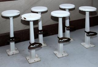 Appraisal: Six cast iron with porcelain seats and original foot rest