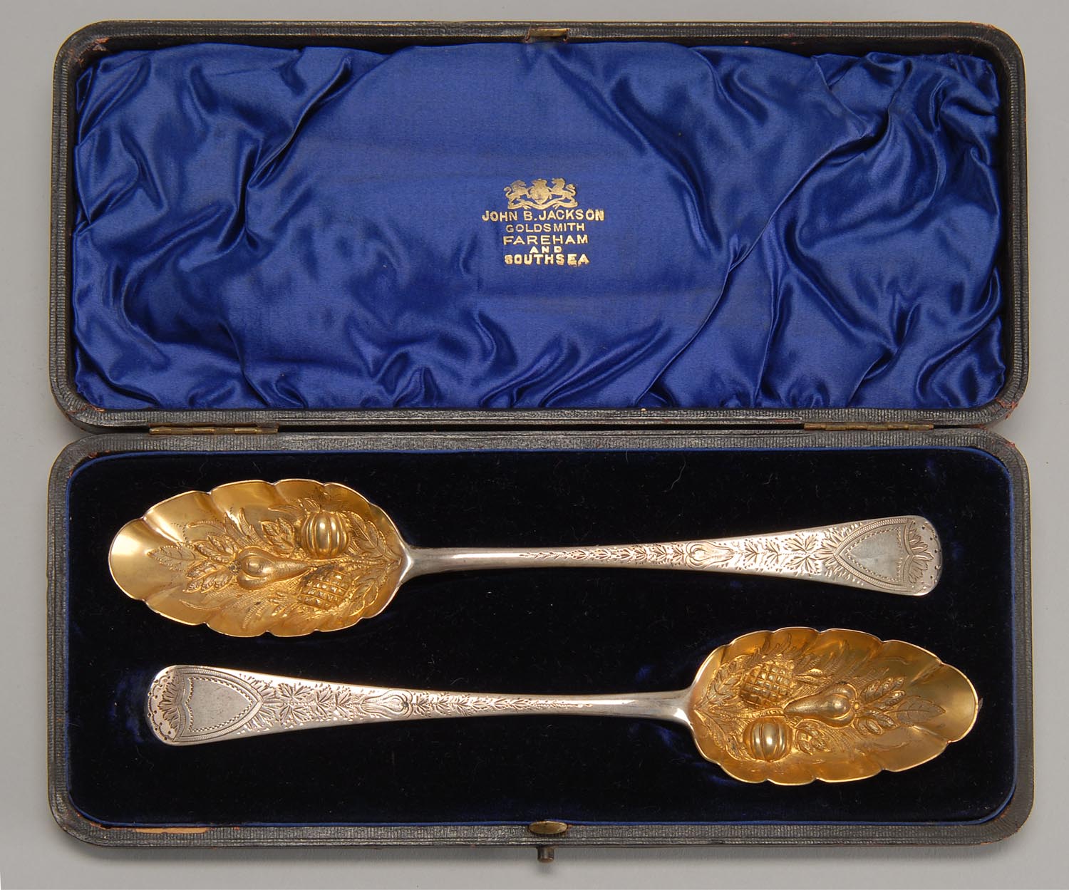 Appraisal: CASED PAIR OF ENGLISH SILVER FRUIT SPOONS London With gold-washed