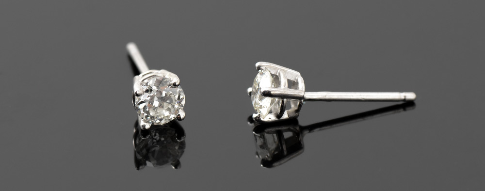 Appraisal: DIAMOND STUD EARRINGS K white gold with period cut round