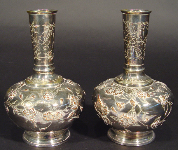 Appraisal: Pair of oriental silver plated bottle vases with copper inlay