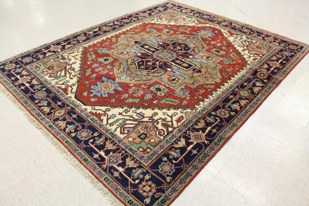 Appraisal: HAND KNOTTED ORIENTAL CARPET Persian Serapi or Heriz design centering