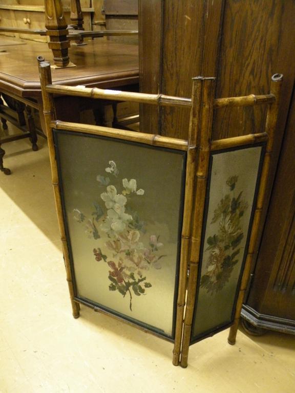 Appraisal: A Victorian bamboo fire screen inset with frosted glass panels