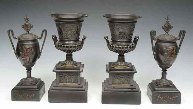 Appraisal: A PAIR OF SPELTER URNS AND COVERS of classical form