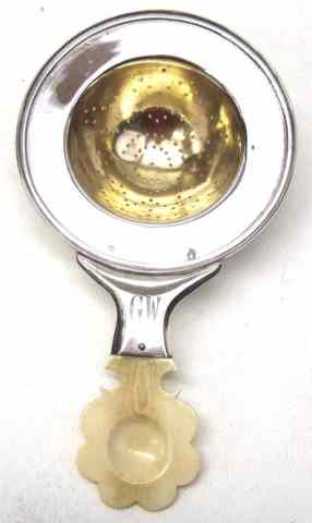 Appraisal: AUSTRIA-HUNGARY SILVER IVORY TEA STRAINER c - hallmarked fine silver