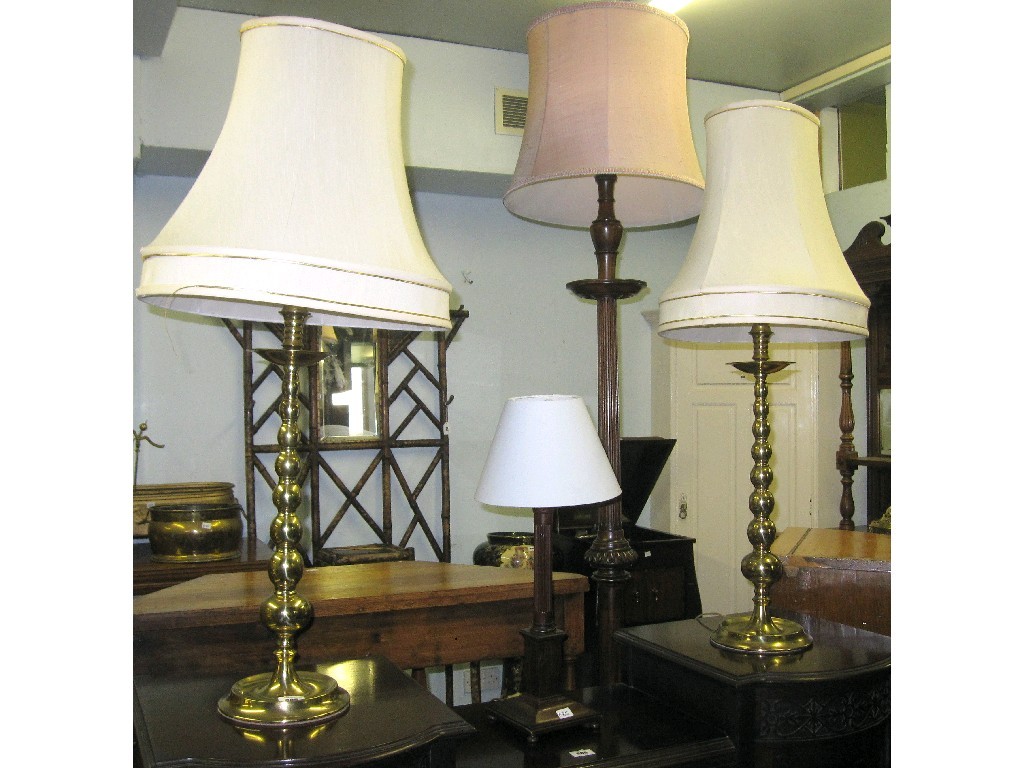 Appraisal: Lot comprising pair of brass lamps and a mahogany lamp