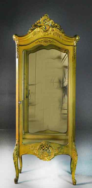 Appraisal: Gilt Curio CabinetCarved scrollwork to crest apron carved cabriole legs