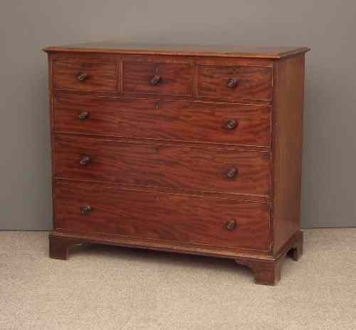 Appraisal: A George IV figured mahogany chest of drawers the top