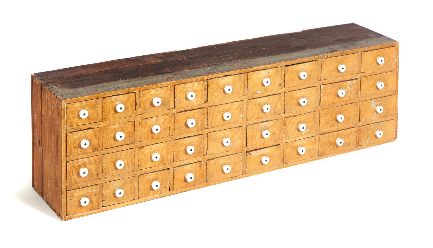 Appraisal: AMERICAN APOTHECARY Mid th century pine Thirty-six dovetailed drawers with