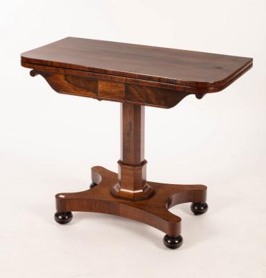 Appraisal: A William IV rosewood card table the fold-over top on