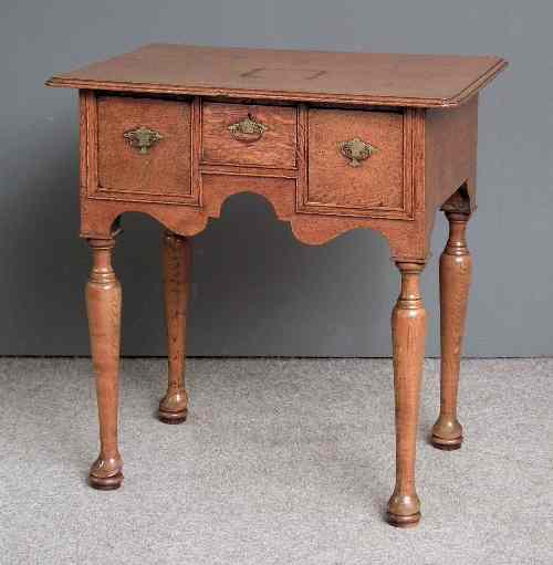 Appraisal: An th Century oak lowboy the later top with moulded