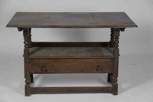 Appraisal: A monk's bench in oak the folding top above a