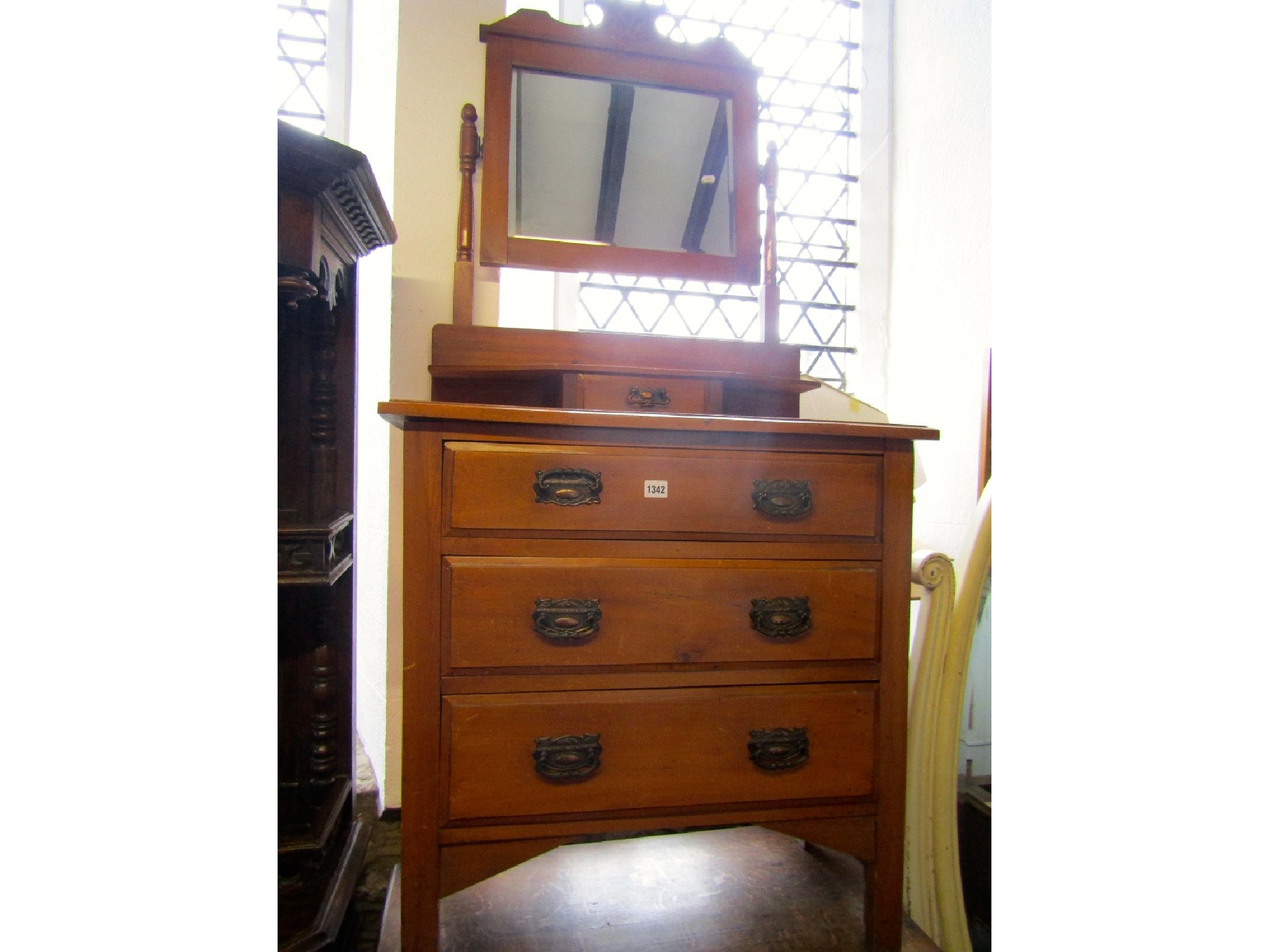 Appraisal: An Edwardian satin walnut dressing chest of three long graduated