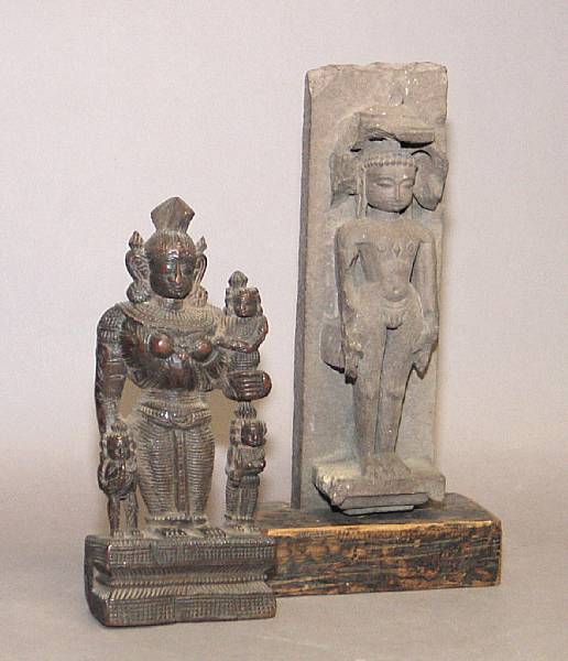 Appraisal: An Indian stone carving of a Jain deity together with