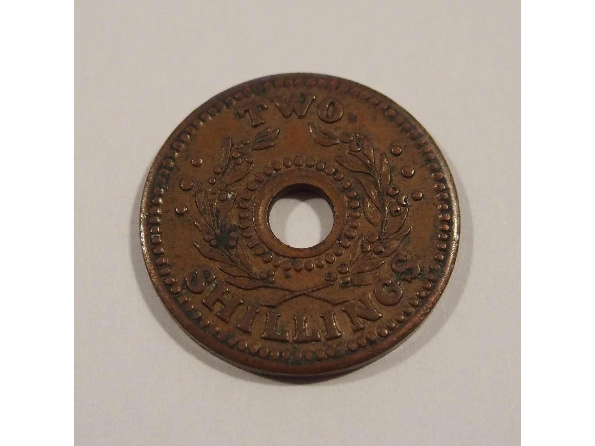 Appraisal: A rare Australian two shilling Internment camp tokenOBV centre hole