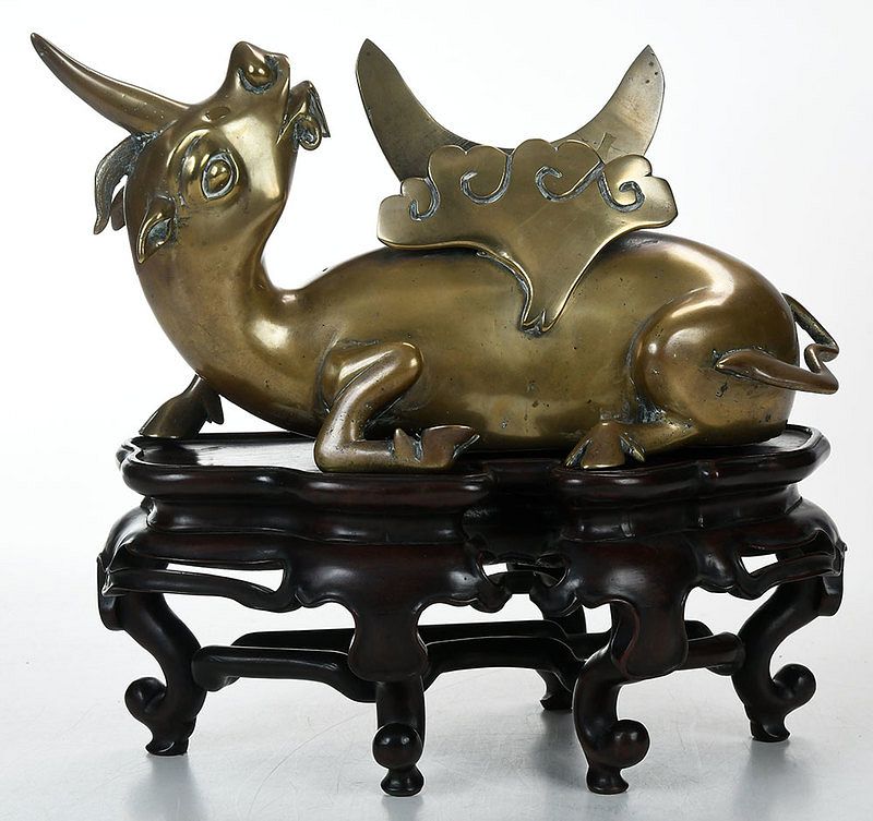 Appraisal: Bronze Qilin Mirror Stand on Wood Base recumbent bronze qilin