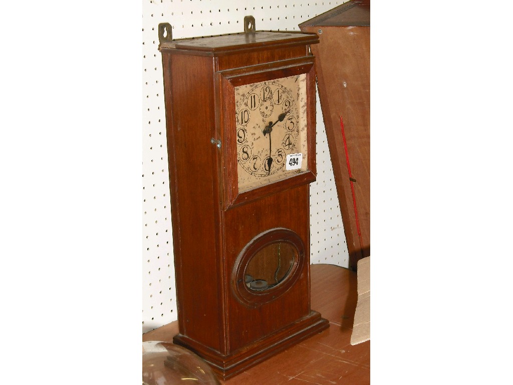 Appraisal: Oak cased electric wall clock the square buff dial with