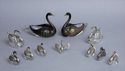 Appraisal: GROUP OF ELEVEN SILVER-MOUNTED GLASS SWAN-FORM TABLE ARTICLES Comprising Continental