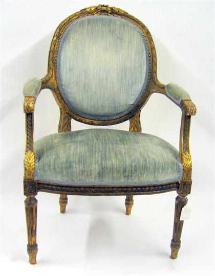 Appraisal: Louis XV style giltwood armchair The oval upholstered back with