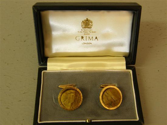 Appraisal: Pair of ct hallmarked gold cuff links inset with fossilized