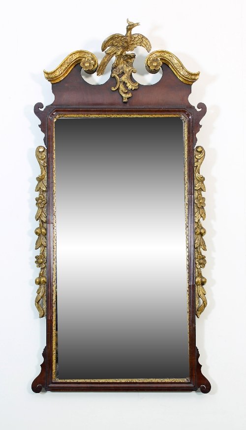 Appraisal: A George II walnut and parcel gilt mirror with gilt