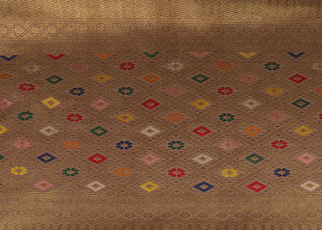 Appraisal: A MALAY DECORATIVE CEREMONIAL SARONG woven geometric and formal designs