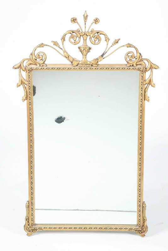 Appraisal: GILT FRAMED MIRROR Metal crest with urn of flowers joining