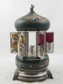 Appraisal: A painted and plated musical cigar container in the form