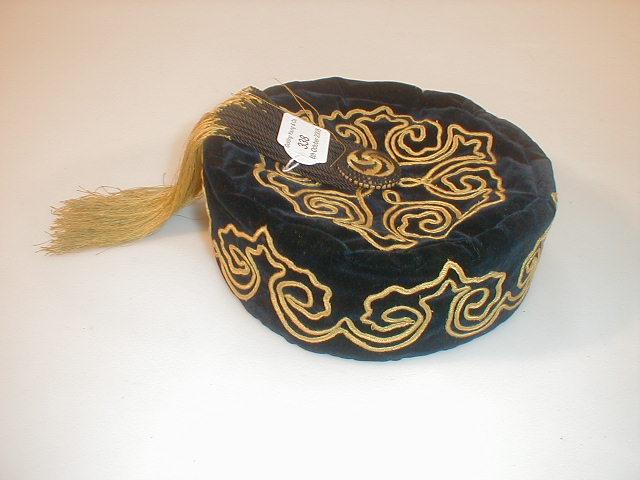 Appraisal: A vintage blue velvet smoking scull cap with gold braid